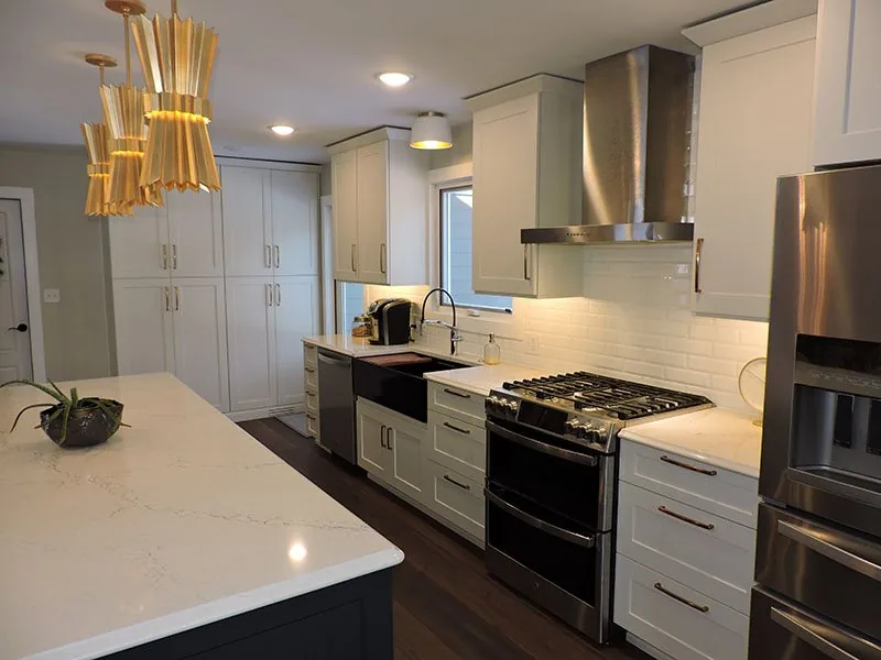 Range wall and black farmhouse sink in the Ada kitchen