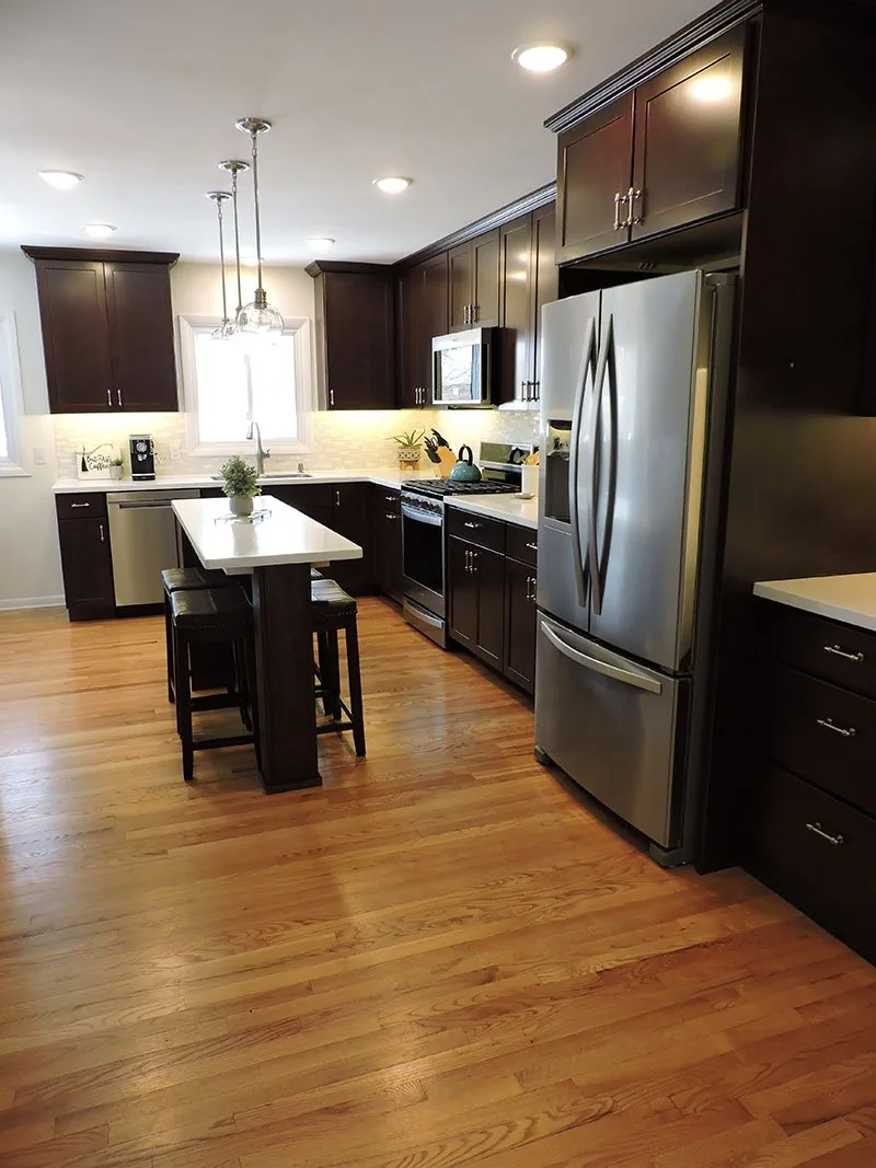 Pendant lights over the island in the Westside Renovation kitchen